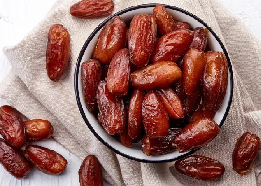 Fresh dates on palm tree
